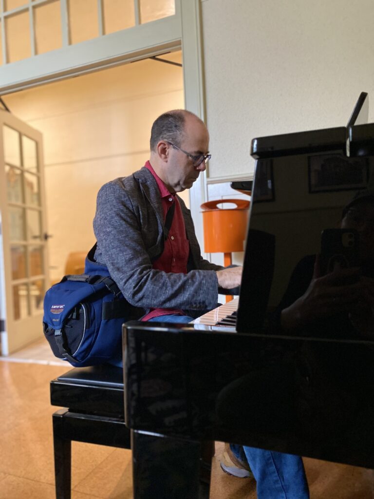 CJ at the piano in the Noble Room